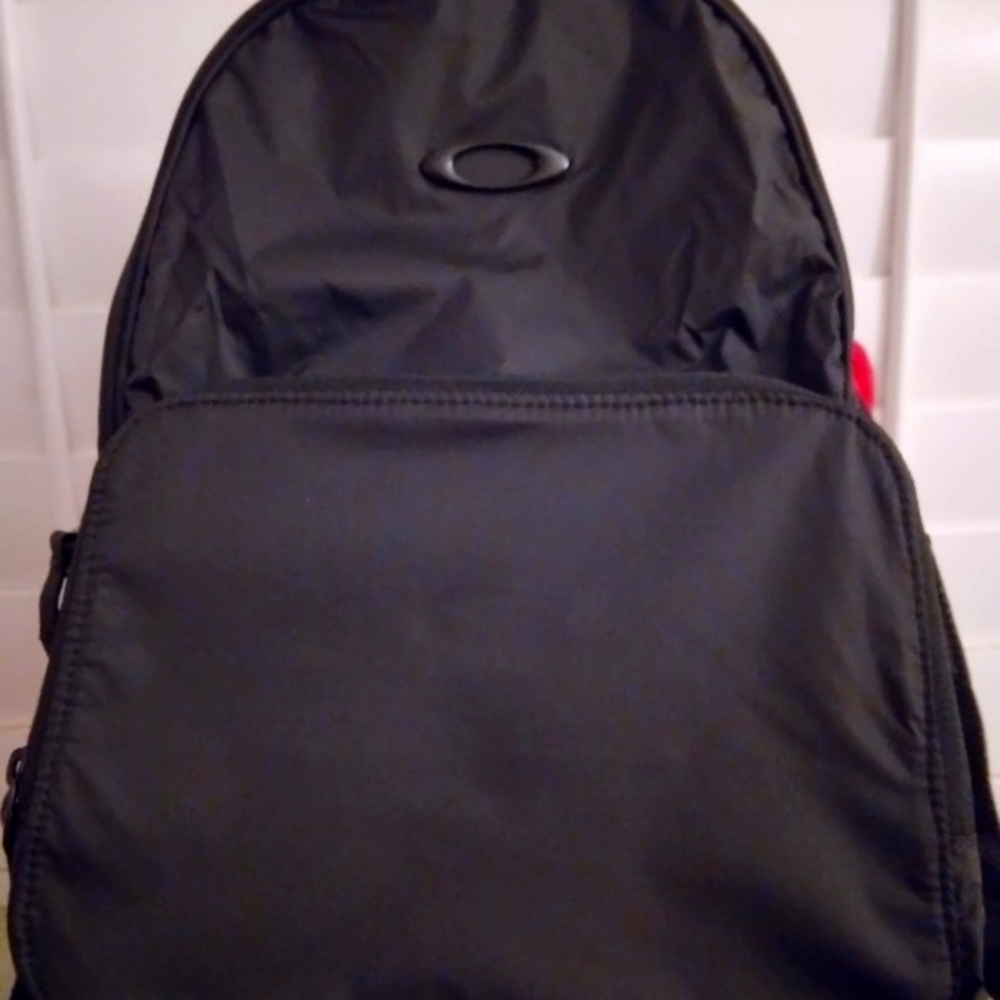 Oakley packable backpack in black nylon fabric.